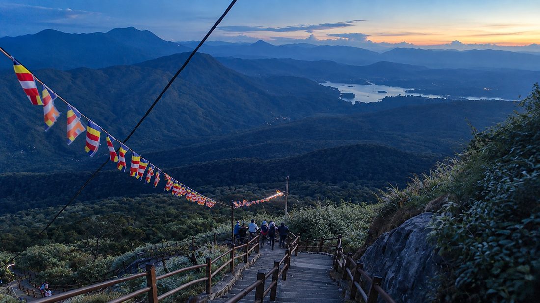 The stairway up Adam’s Peak, hung with prayer flags above the hills