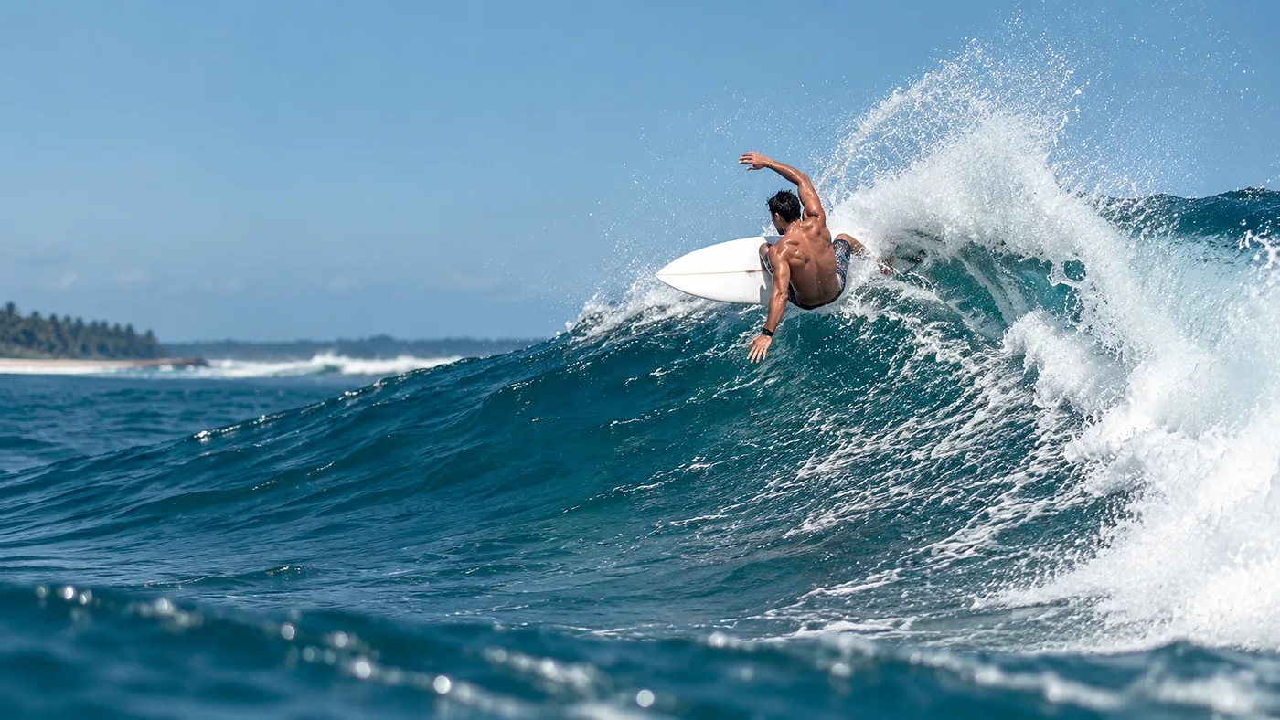 A surfer on a wave at Main Point, Arugam Bay