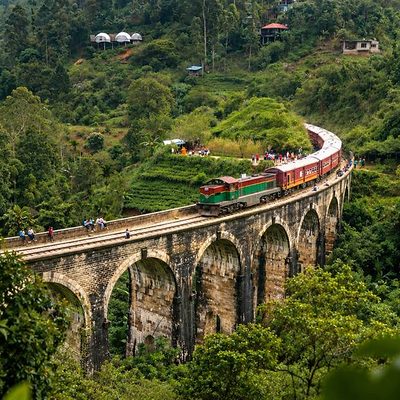 A train crossing the Nine Arch Bridge near Ella, Sri Lanka