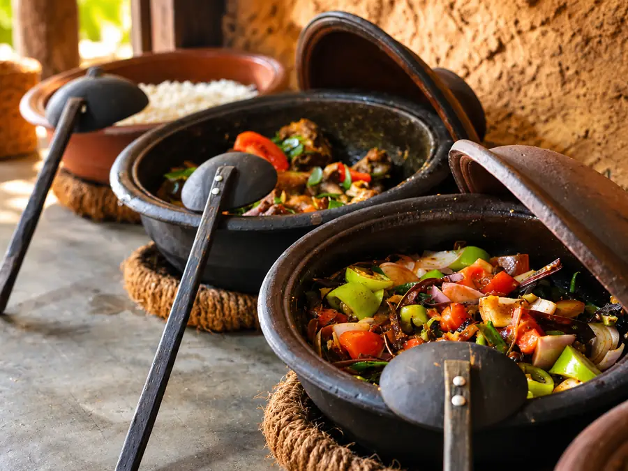Curries in clay pots in a village kitchen