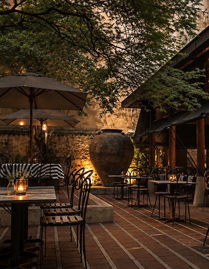 The courtyard terrace at the Gallery Cafe in Colombo, lantern-lit tables under trees