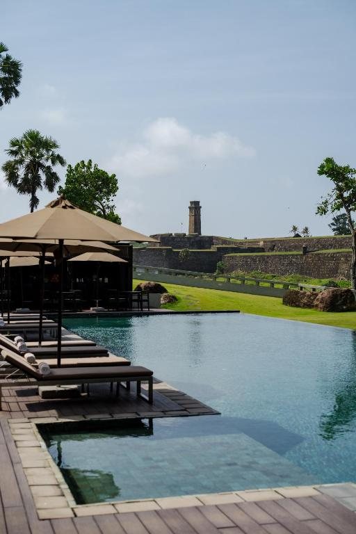The pool at Le Grand Galle with Galle Fort across the water