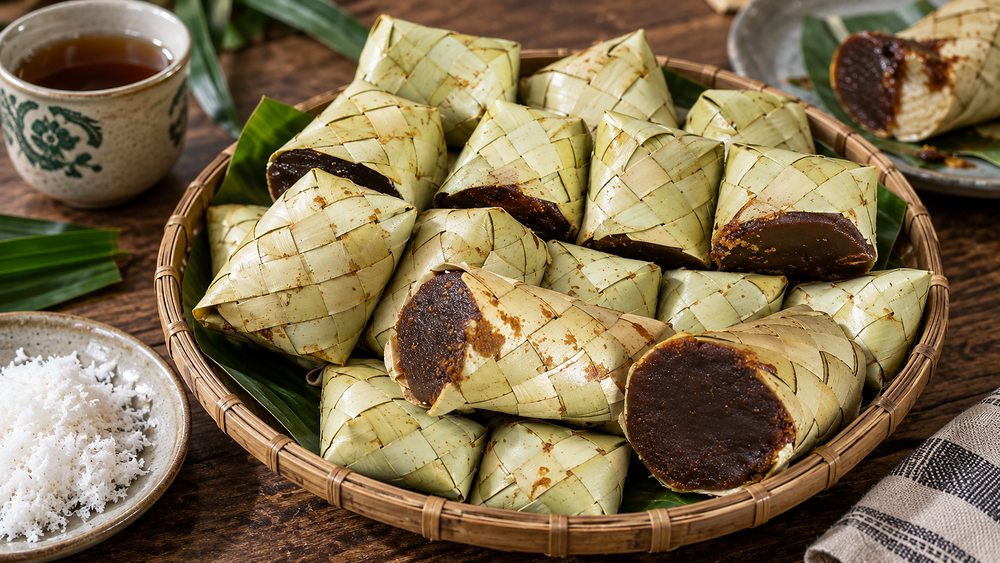 Palmyra jaggery wrapped in woven palm-leaf packets with grated coconut, Jaffna, Sri Lanka