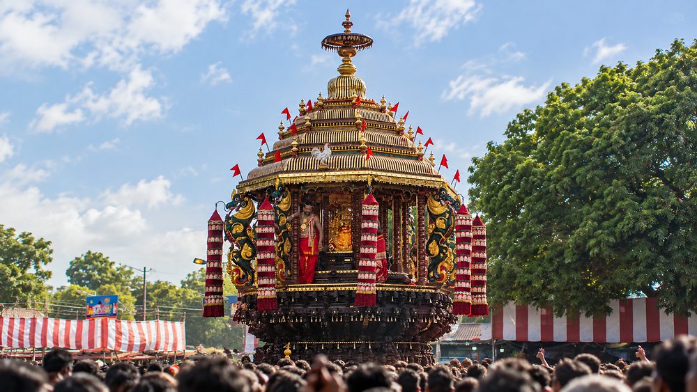 The gilded Nallur Ther temple chariot drawn through crowds during the festival, Jaffna, Sri Lanka