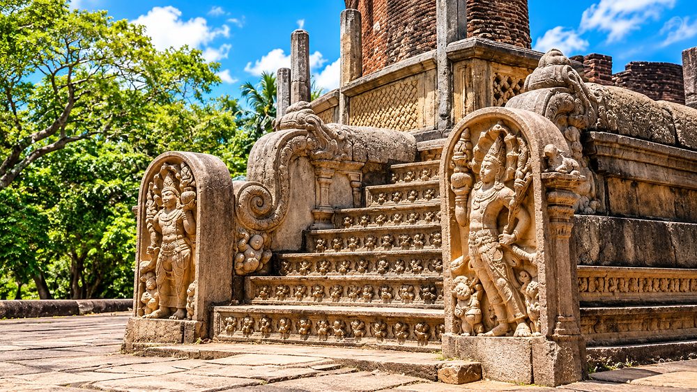 Carved guardstones flanking twelfth-century temple steps at Polonnaruwa, Sri Lanka