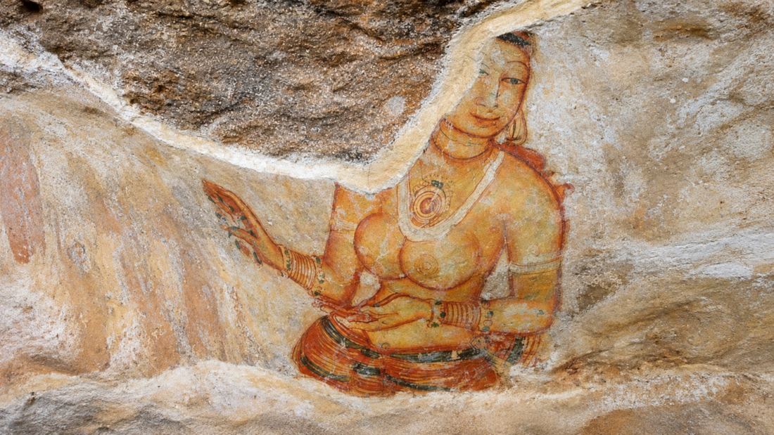 A fifth-century fresco of a bare-shouldered woman painted on the rock face at Sigiriya, Sri Lanka