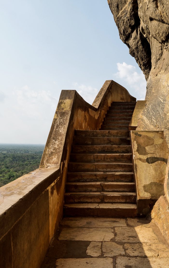 The stone stairway climbing the flank of Sigiriya rock
