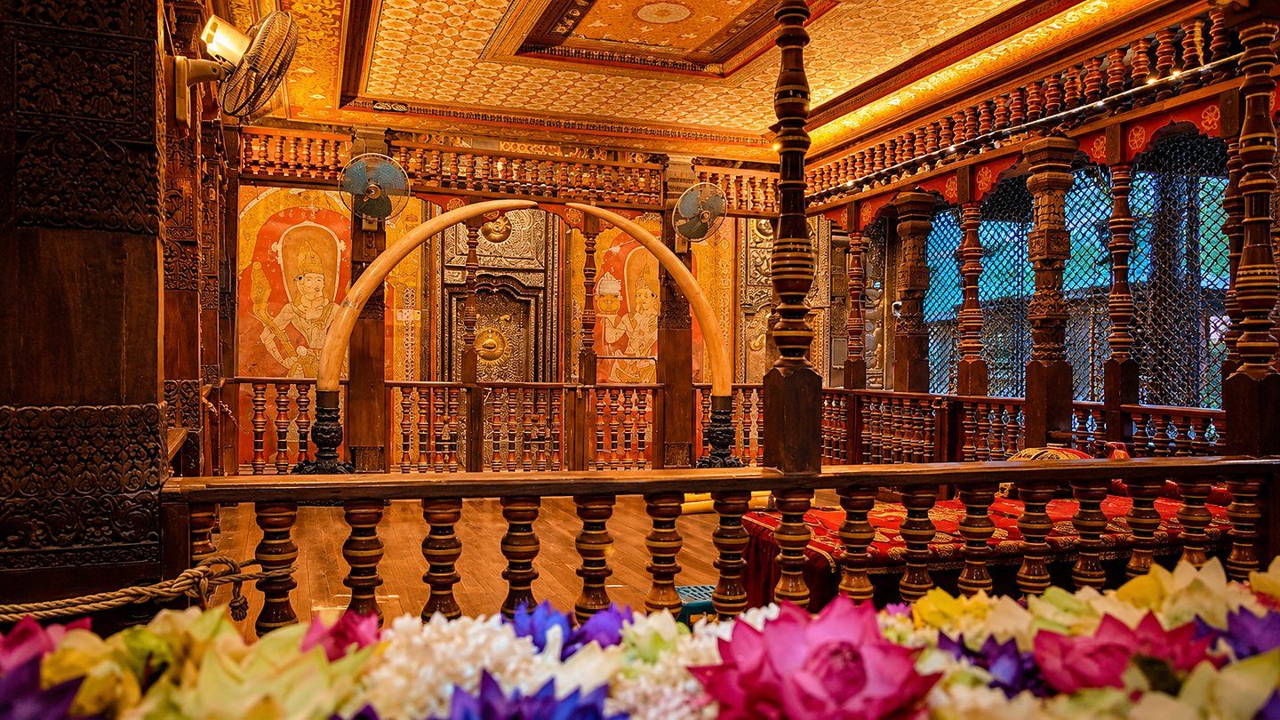 Carved timber columns and tusks before the inner shrine of the Temple of the Tooth, Kandy, Sri Lanka