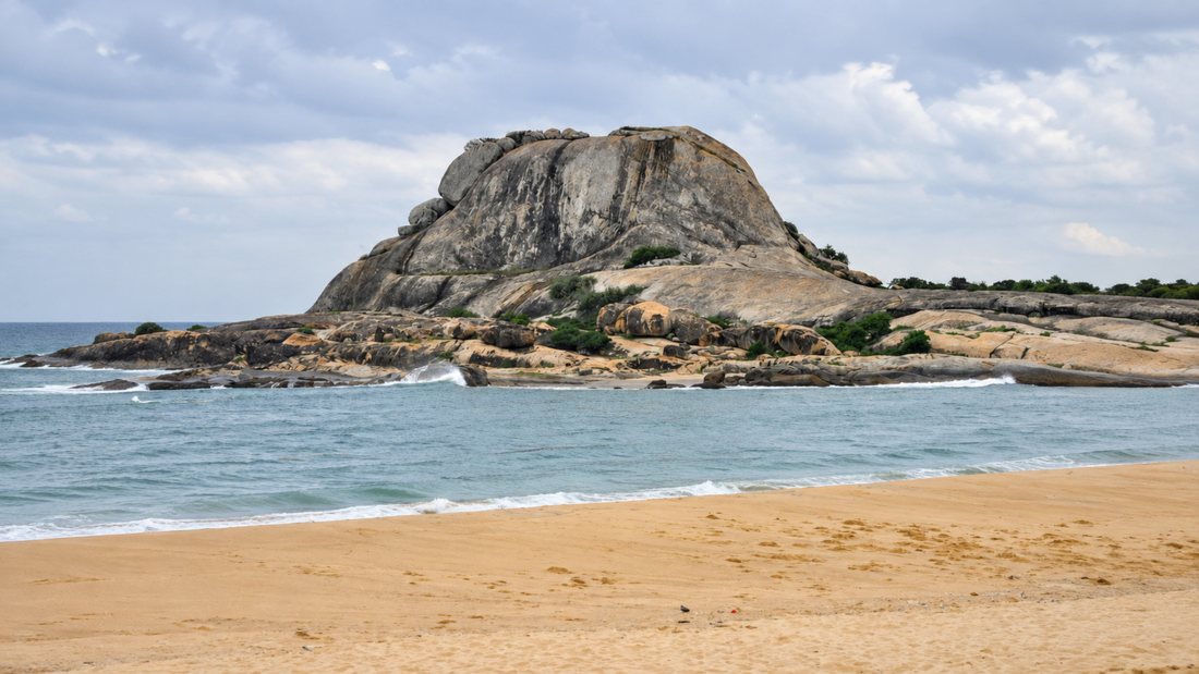 The protected nesting beach at Rekawa below its rock headland, Sri Lanka